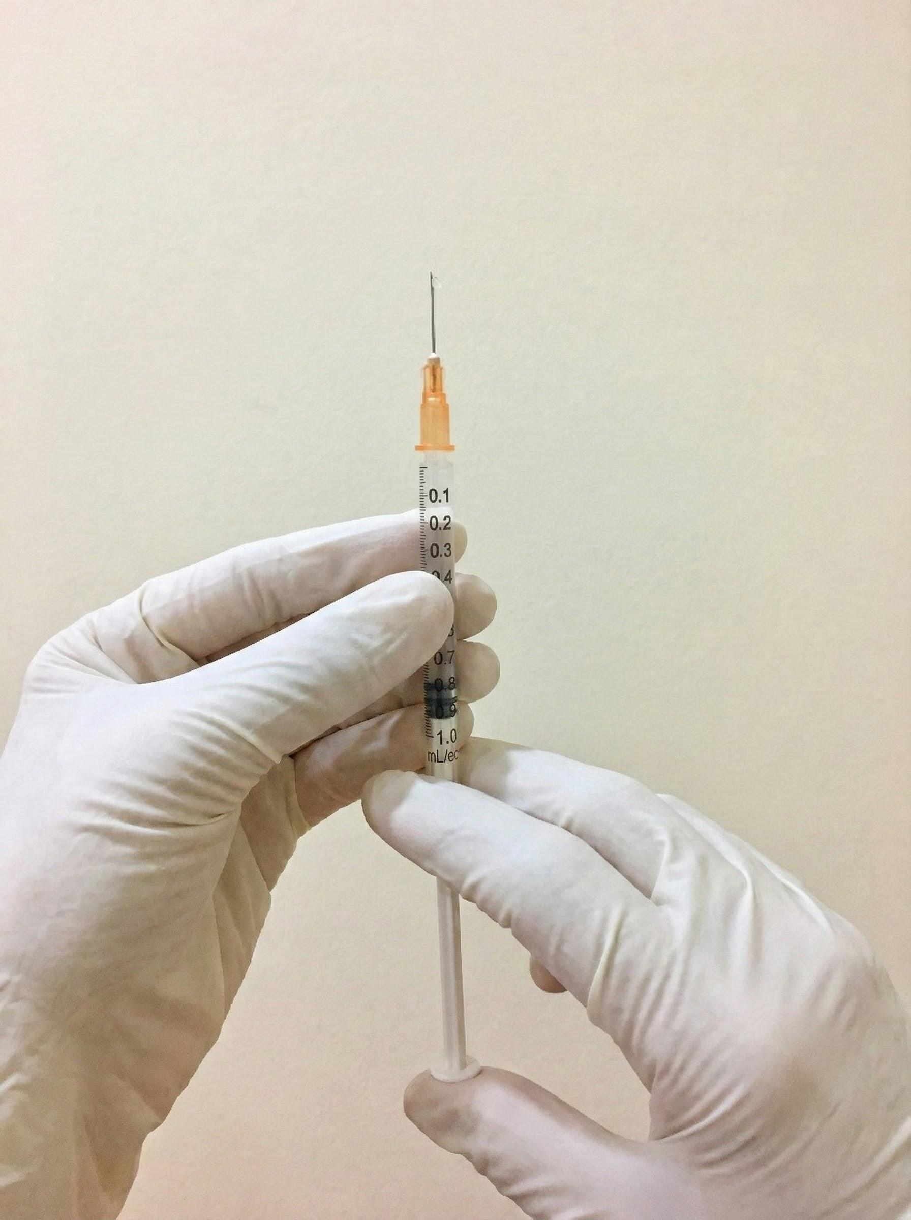Medical syringe with gloves